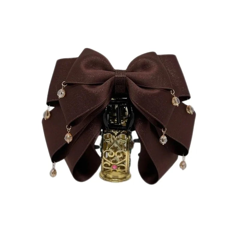 Elegant Sparkling Bow Hair Claw with Dangling Crystal Charms for Women Stylish Hair Accessory for Evening Parties and Daily Look Quake