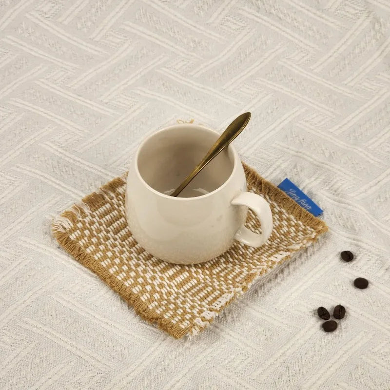 Vintage-inspired, tassel-trimmed woven coasters. checkered square fabric trivets, perfect for coffee, tea, and more Quake