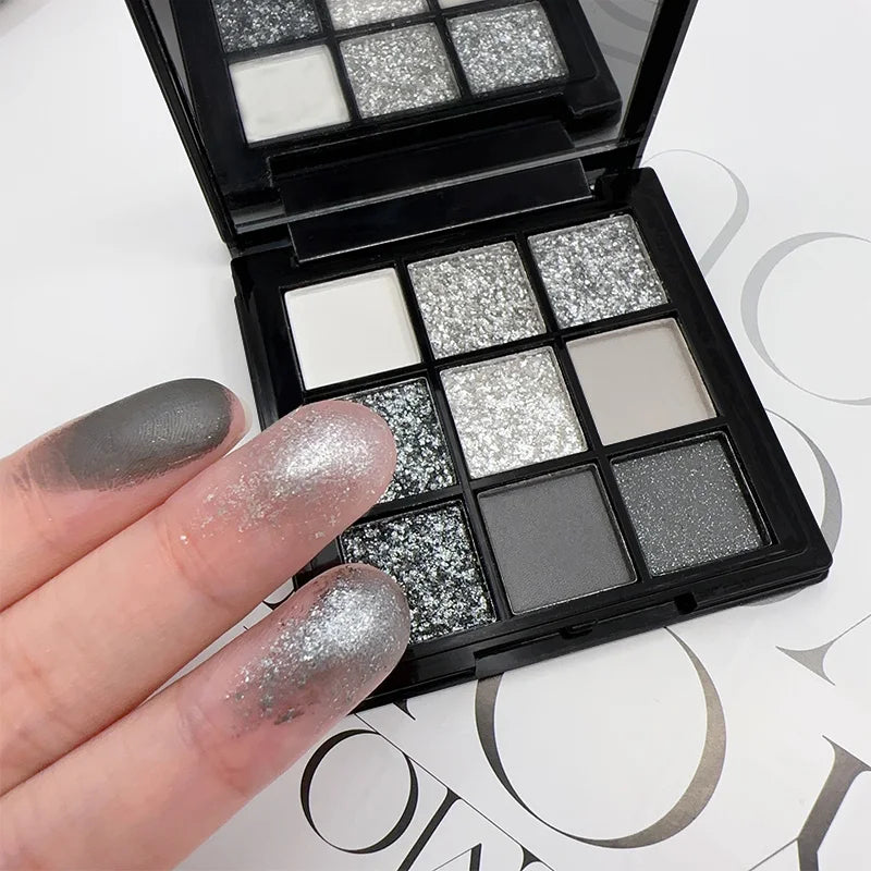 Black Swan 9-Color Eyeshadow Palette Mesmerizing Glitter Glam,Dramatic Smoky Punk Effects,Hues in Light Gray&Dark Silver Makeup Quake
