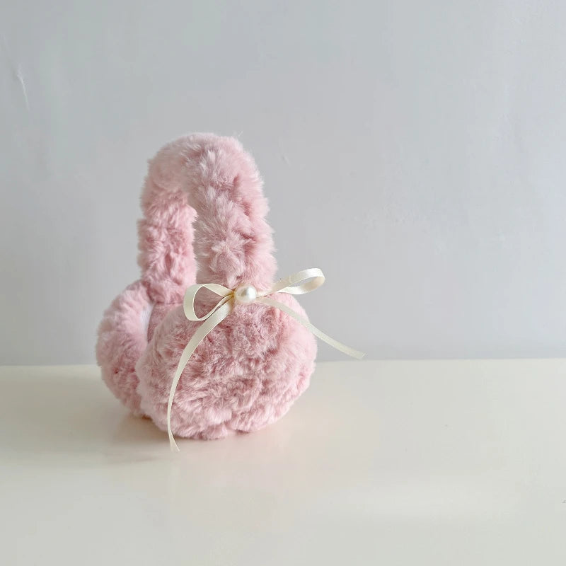 1pc Winter Warm Sun Pearl Bow Plush Earrings Female Students Windproof Ear Protection Warm Earrings Quake pink
