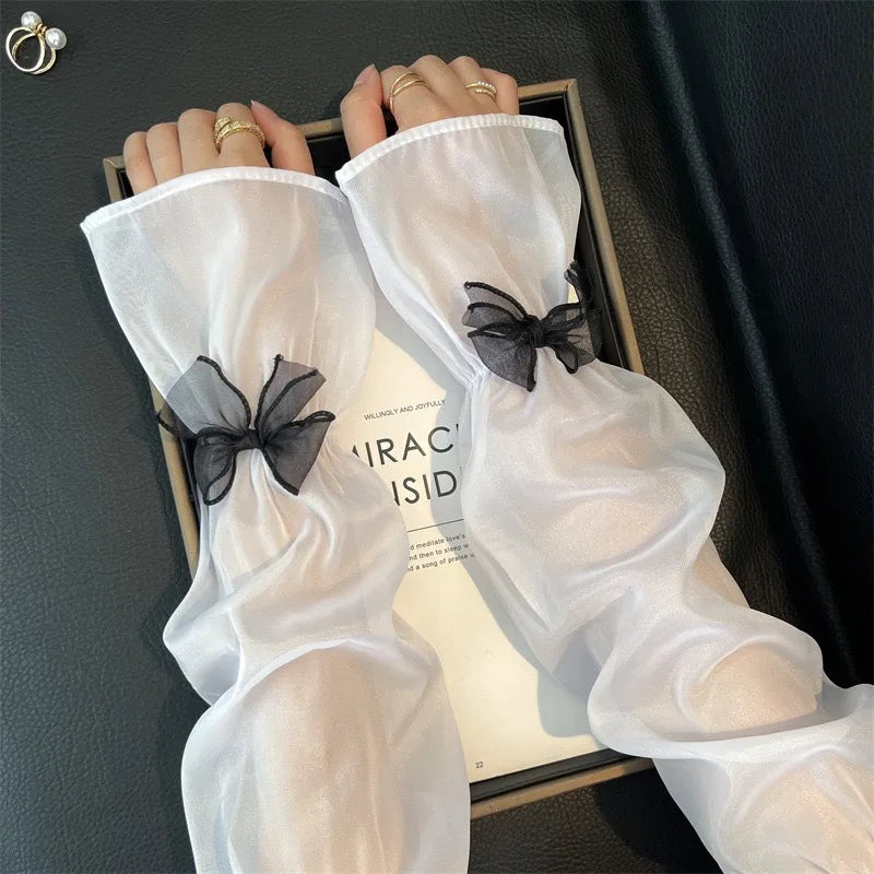 Elegant Sheer Arm Sleeves with Black Bow Decor Sweet Feminine Sun Protection Accessory for Dresses and Outfits Quake white One Size