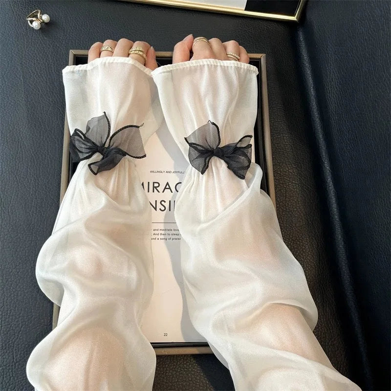 Elegant Sheer Arm Sleeves with Black Bow Decor Sweet Feminine Sun Protection Accessory for Dresses and Outfits Quake