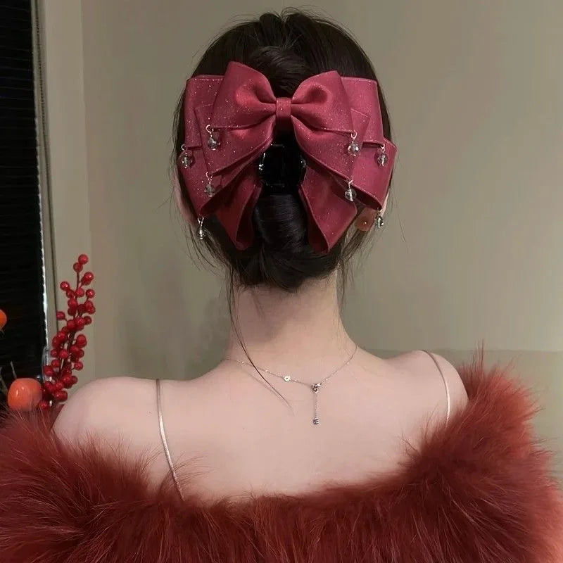 Elegant Sparkling Bow Hair Claw with Dangling Crystal Charms for Women Stylish Hair Accessory for Evening Parties and Daily Look Quake