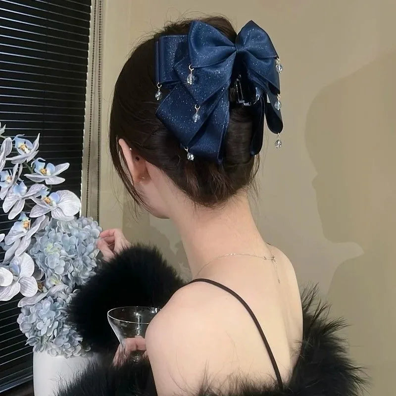 Elegant Sparkling Bow Hair Claw with Dangling Crystal Charms for Women Stylish Hair Accessory for Evening Parties and Daily Look Quake