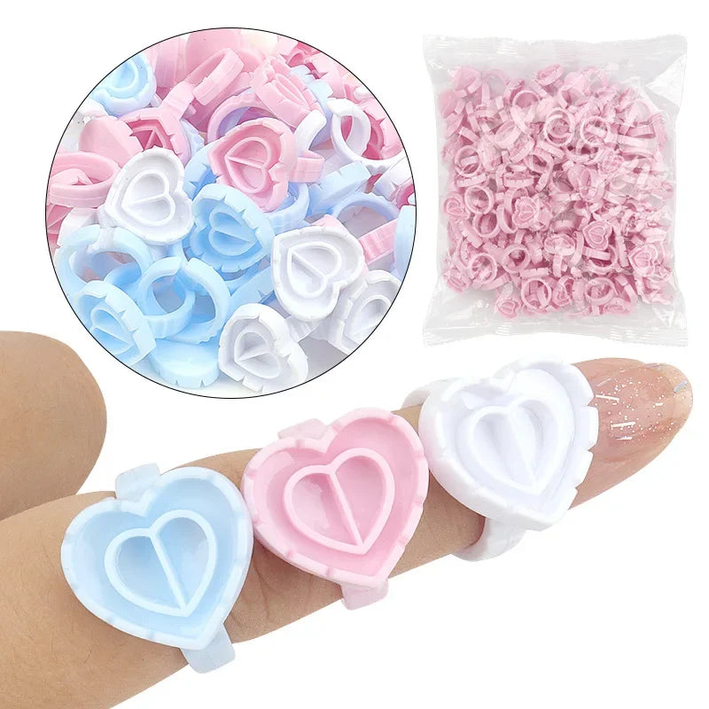 vvocci 100 PCS Heart-shaped Glue Ring Cup Disposable Plastic Eyelash Extension Tattoo Pigment Holder Pallet Lash Makeup Tools Quake