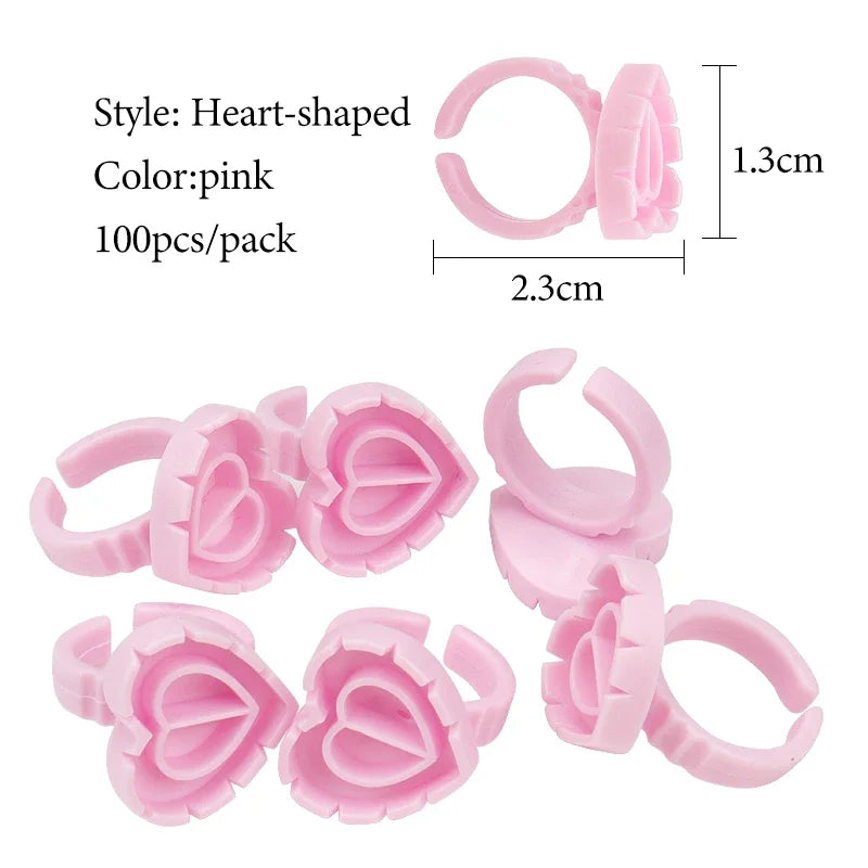 vvocci 100 PCS Heart-shaped Glue Ring Cup Disposable Plastic Eyelash Extension Tattoo Pigment Holder Pallet Lash Makeup Tools Quake M45 Pink